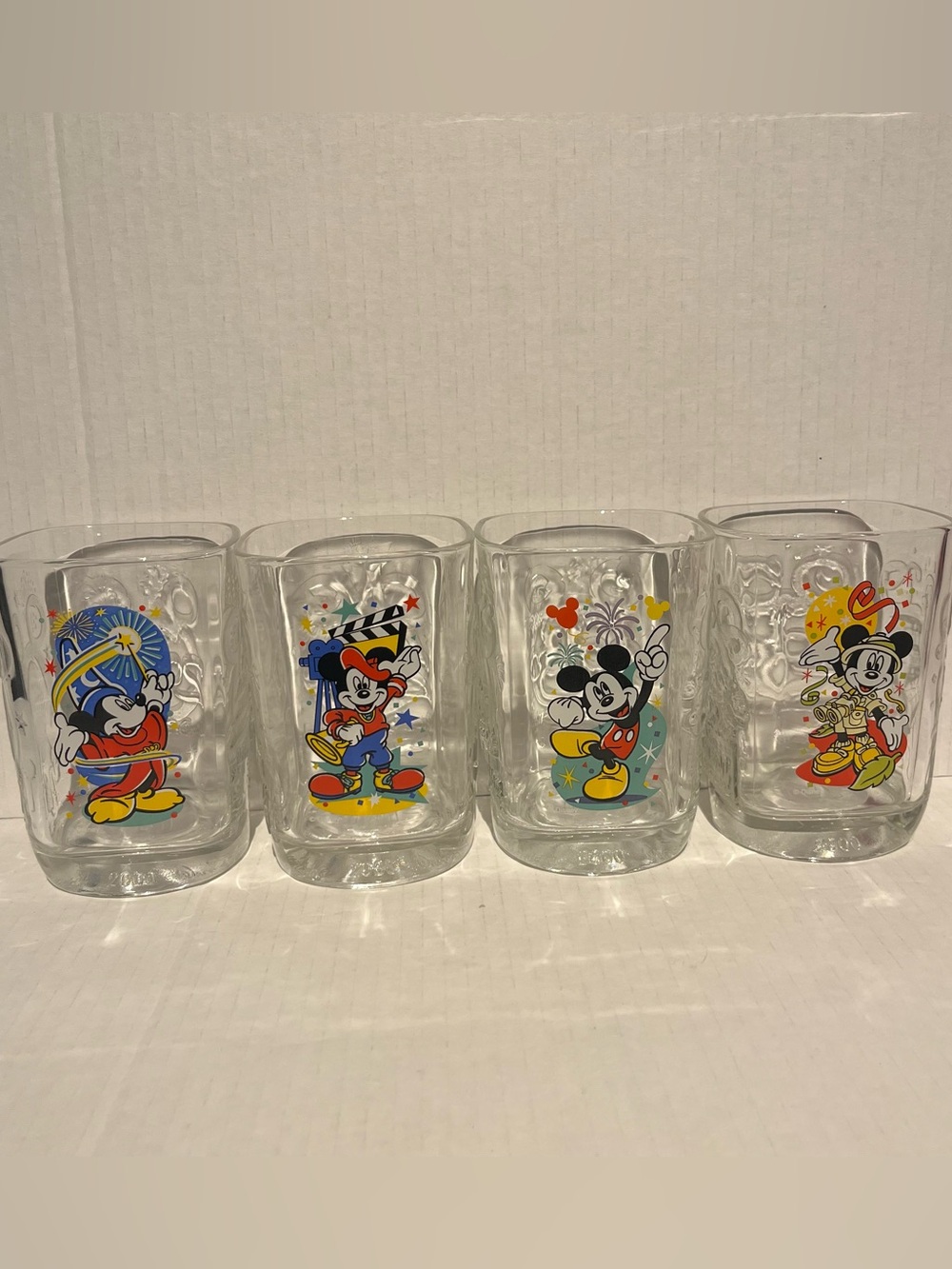 Vintage set of 4 McDonald's Walt Disney World Millennium Celebration glasses.